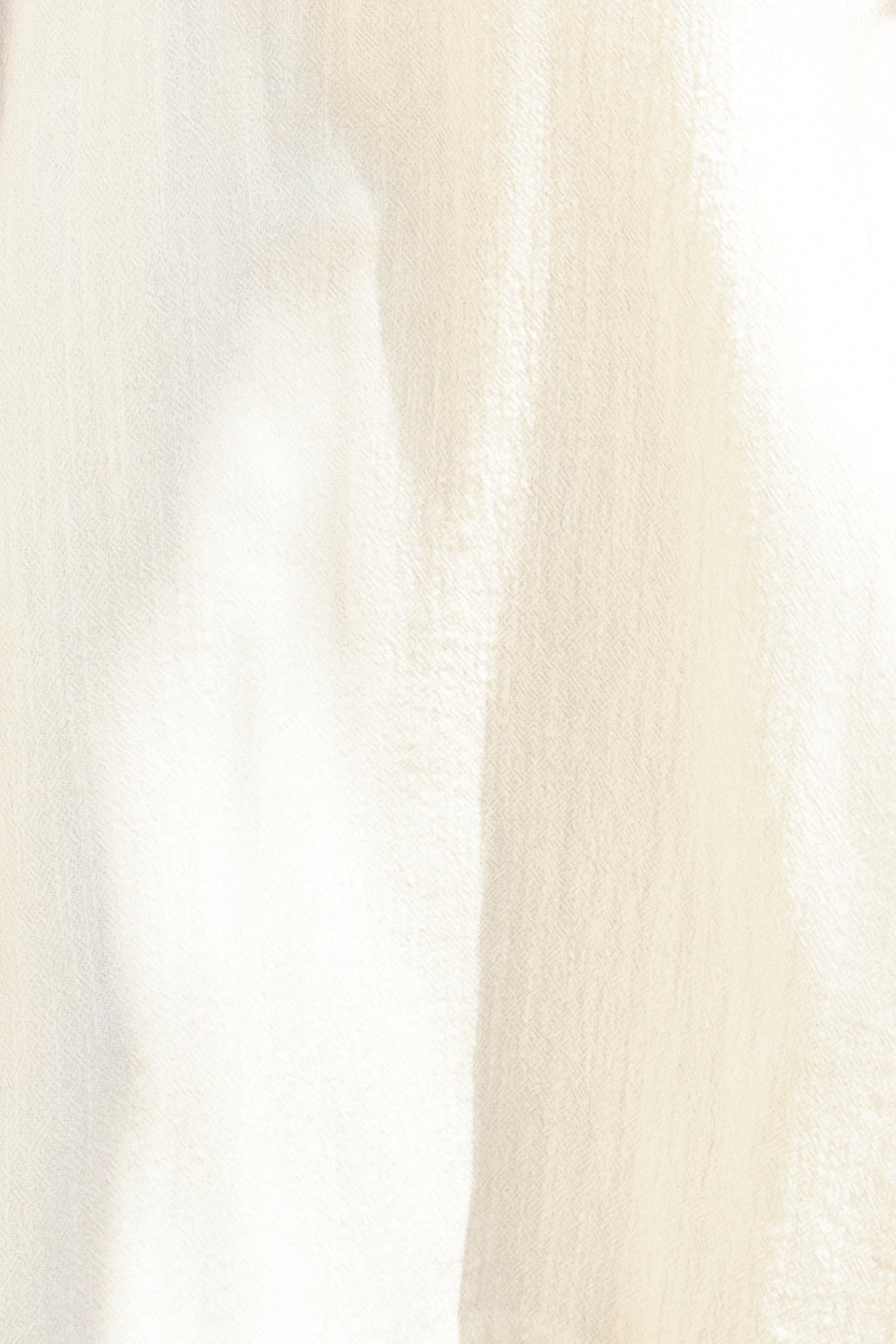 Close-up of a texture alabaster fabric with a subtle pattern.